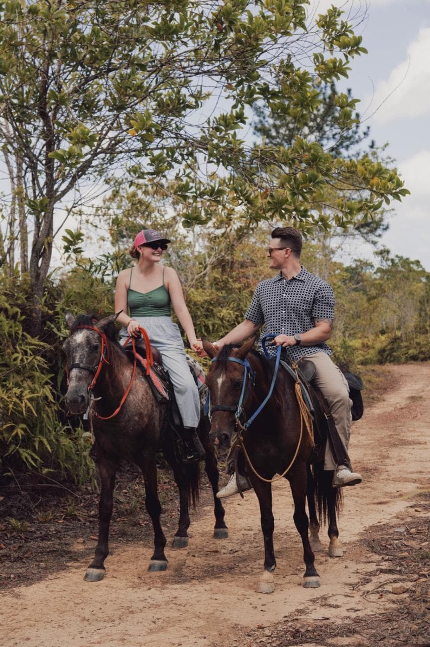 Horseback riding along scenic trail in Belize